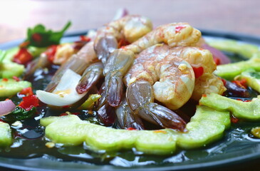 raw shrimp dressing spicy and sour fish sauce Thai food on plate