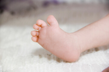 small foot of a newborn baby