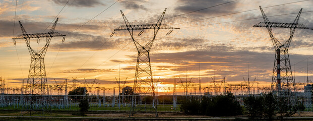 high voltage pylons against the background of the evening sky