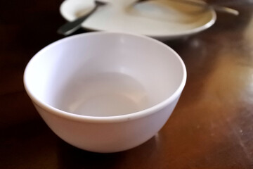 Fototapeta na wymiar Small empty bowl on wooden table background