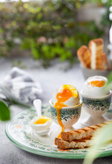 Soft-boiled egg in an eggcup with toast