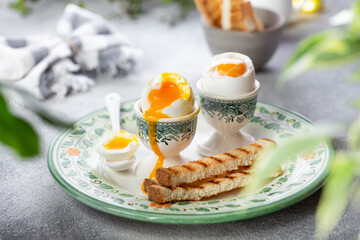 Soft-boiled egg in an eggcup with toast