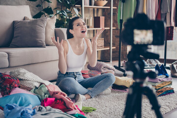 Obraz premium Portrait of her she nice attractive desperate girl sitting on floor messy room making cleaning chores household recording online internet video in house apartment flat indoors