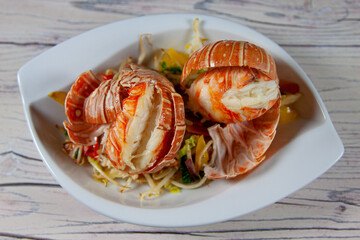 Lobster tails on stir fried vegetables