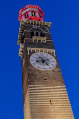 Fototapeta na wymiar Medieval tower of Lamberti (Torre dei Lamberti, XI century) at evening. 84 m Lamberti Tower in Verona is UNESCO world heritage site. Italy, Europe.
