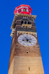 Fototapeta na wymiar Medieval tower of Lamberti (Torre dei Lamberti, XI century) at evening. 84 m Lamberti Tower in Verona is UNESCO world heritage site. Italy, Europe.