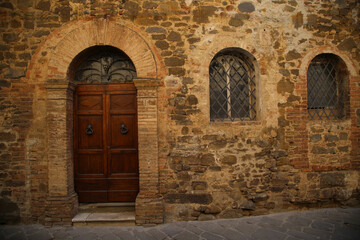Fototapeta na wymiar Entrance door of a house in Montalcino in Tuscany, Italy