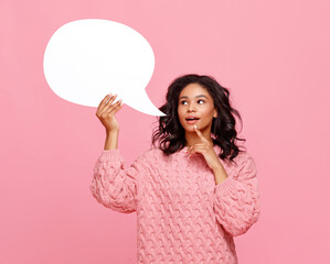 Curious ethnic woman with speech bubble