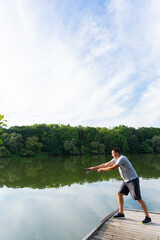Fototapeta na wymiar Young man fishing in the river