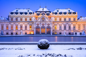Vienna, Austria - Winter snowy night at Belvedere, travel landscape.