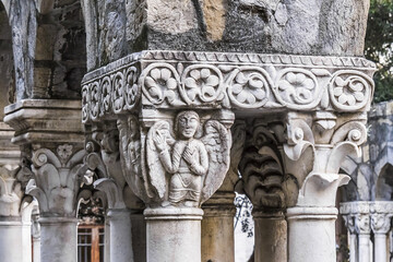 12th century Ruins of old cloisters standing in a small garden in Genoa, Italy.