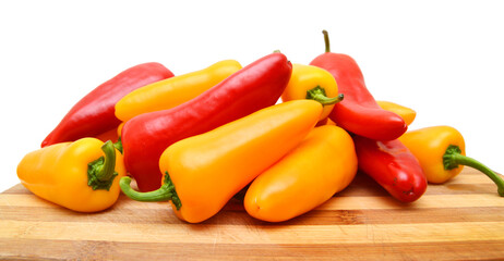 Group Sweet Mini Peppers in wooden board