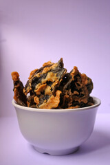 Snacks food, chips of A. auricula-judae Mushroom on a white bowl