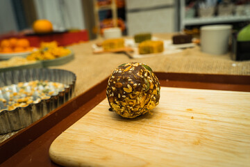Mixed components inside moon cake, homemade cantonese moon cake pastry on baking tray before baking for traditional festival.