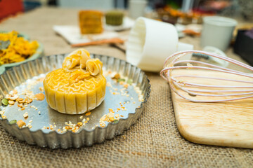 the wooden mold for moon cake, homemade cantonese moon cake pastry on baking tray before baking for traditional festival.