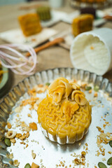 the wooden mold for moon cake, homemade cantonese moon cake pastry on baking tray before baking for traditional festival.