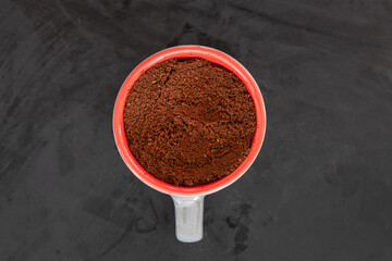 Close-up of instant coffee in a cup on dark background.
