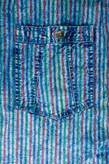 Blue washed faded jeans striped texture with seams, clasps, buttons and rivets