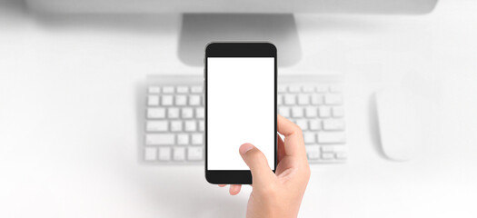 Hand holding smartphone device touching screen