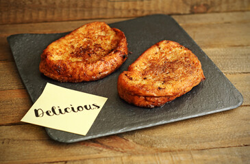 Dessert, French toast on wood on plate
