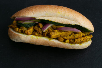 Indian and Surinamese food, curry, sandwiches, soup, Dahl, chicken and vegetables. With codiments like saffron and chilli sauce.