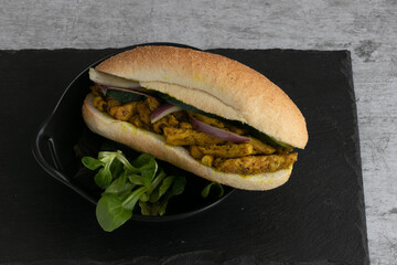 Indian and Surinamese food, curry, sandwiches, soup, Dahl, chicken and vegetables. With codiments like saffron and chilli sauce.