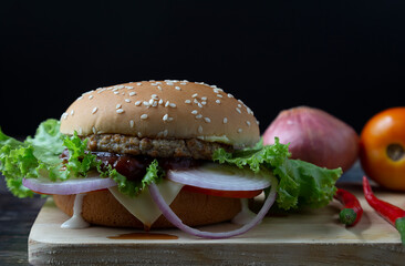 
Beef burger with tomato, onion and cheese on a stick