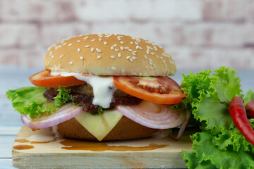 
Beef burger with tomato, onion and cheese on a stick
