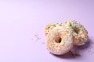 Tasty donuts on blue background, close up