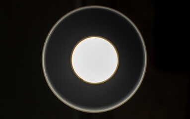 White glowing circles on a black background.