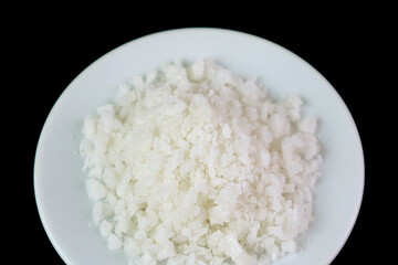Plate of Sea Salt Isolated on Black Background