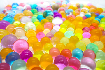 Small multi-colored balls lying in perspective from the camera