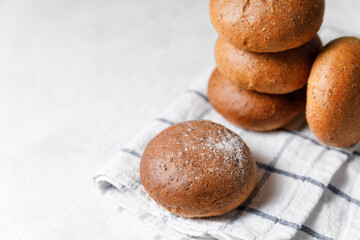 Fresh baked buns on bright background. Still life captured, homemade bread concept with copy space