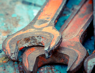 Old spanners. Grunge background of instruments. Keys close-up. Vintage turquoise and red