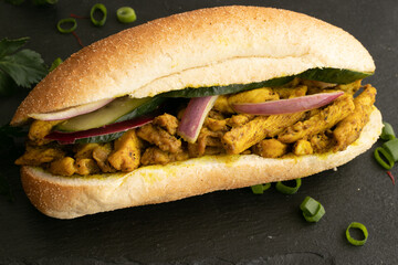 Indian and Surinamese food, curry, sandwiches, soup, Dahl, chicken and vegetables. With codiments like saffron and chilli sauce.