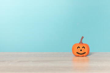 Halloween holiday concept with jack o lantern smiling face and blue background