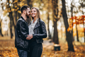 Portrait of a young loving couple. Man and woman hugging and smiling