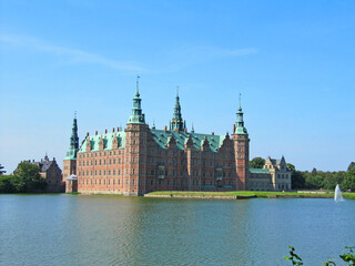 Red brick scandinavian castle on the lake, Denmark