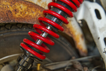 Red suspension absorber for Old motorcycle vintage and beautiful.