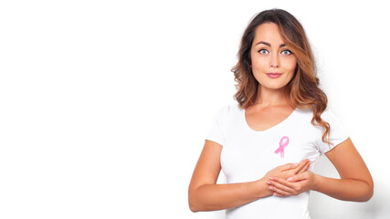 Woman in white t-shirt with pink ribbon supporting breast cancer awareness campaign