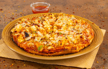 Indian Style of Italian Dish Paneer Pizza Topped with Cottage Cheese