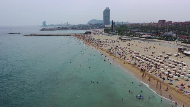BARCELONA, SPAIN - JULY 07, 2019: Scenic view from drone of seaside area of Barcelona on sunny summer day, Catalonia 