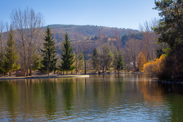 Panoramic view of Lake Osseja on Autumn day where ocher and orange colors invade the scene. Cignes, France