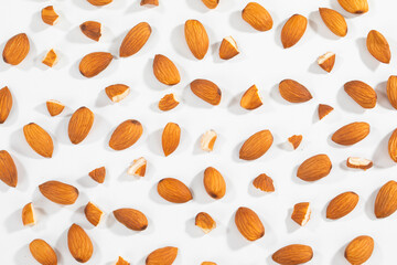 Almond Pieces Broken Shell Nut Flying on White Background