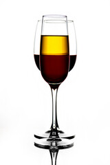 Wine glasses of different shapes with multi-colored drinks on a white background with reflection