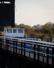 Large freight barge crossing a canal aqueduct over a river