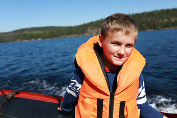 Kid on boat in Ladoga skerries