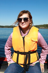 Woman in life jacket on boat