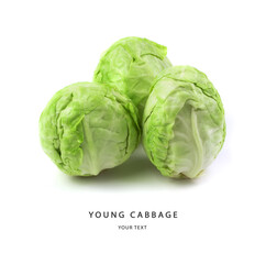 Fototapeta premium White cabbage fresh, young with water drops isolated on a white background. With an inscription and a place to copy. Side view. The concept of proper nutrition.