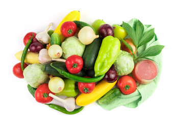 Composition of ripe fresh vegetables, a glass of vegetable juice and a green branch on a white background with water drops. Food background. The concept of natural products, proper nutrition.